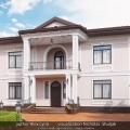 Detached house in the classic style with a landscape design.