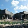 Black House On Nevezis River Slope