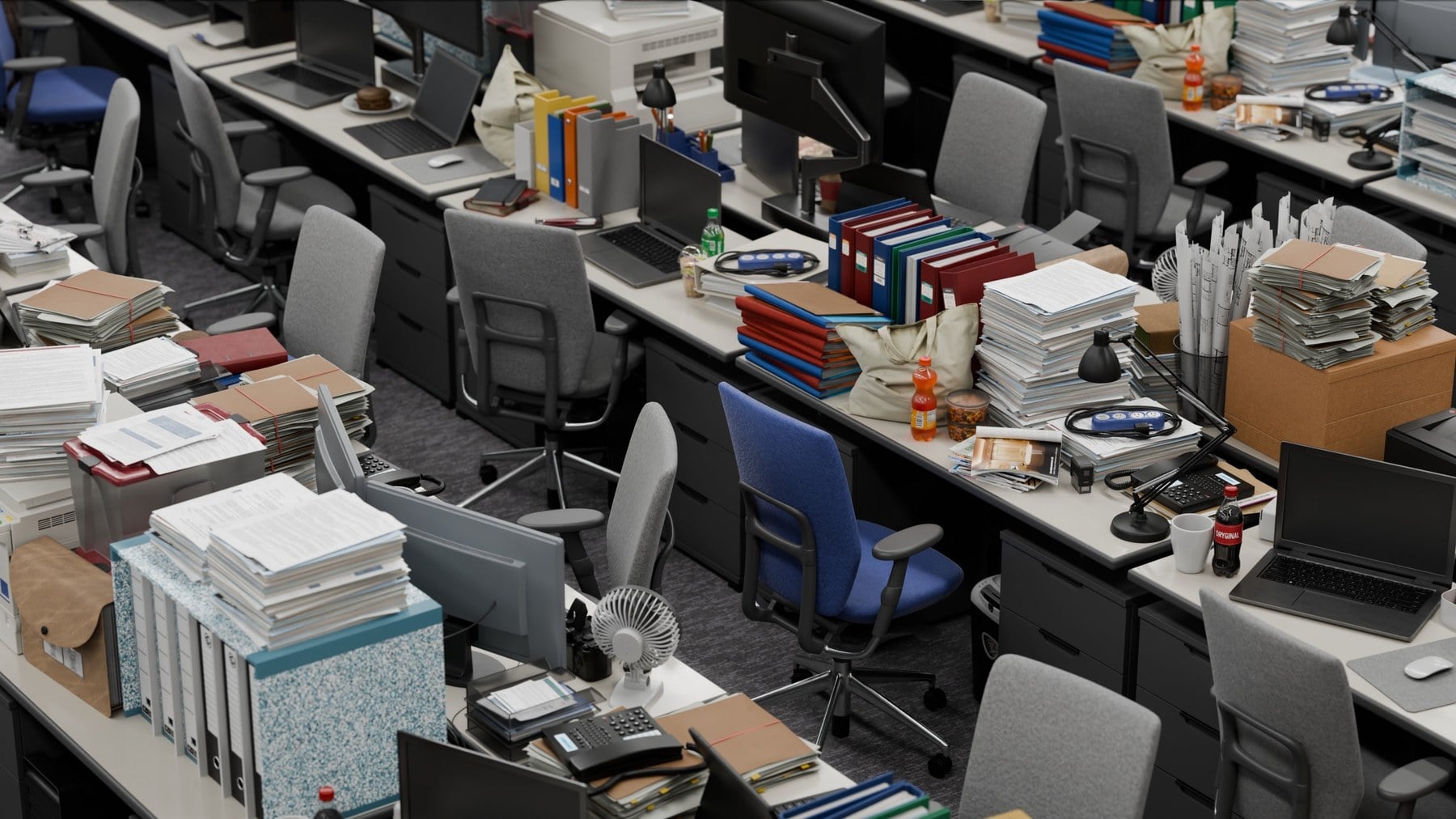 Open-plan office with cluttered desks